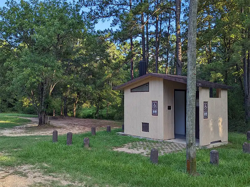 Photo of the vault toilet at kellys pond campground in texas