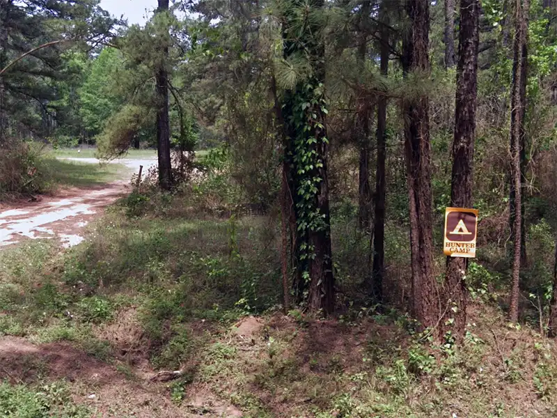 Photo of the entrance to shell oil road hunters camp in texas