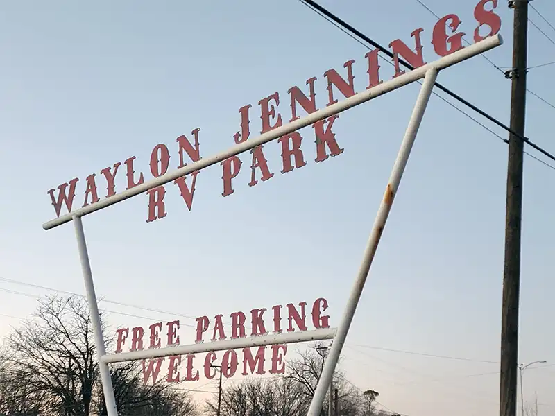 entrance sign for waylon jennings rv park in littlefield, texas